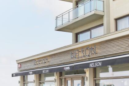 Akoestische spanplafonds en printwand restaurant aan zee